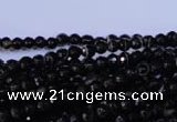 CAG2312 15.5 inches 4mm faceted round black line agate beads
