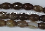CAG3129 15.5 inches 10*14mm faceted rice brown line agate beads