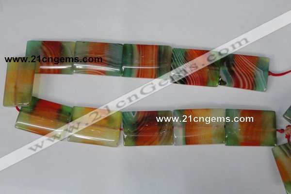 CAG1057 15.5 inches 25*35mm flat tube rainbow agate beads