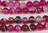 CAG2085 15.5 inches 6mm faceted round fuchsia line agate beads