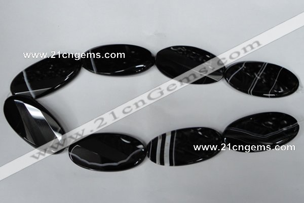 CAG3086 15.5 inches 25*50mm faceted oval black line agate beads