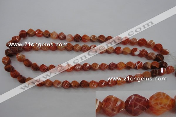 CAG580 15.5 inches 8*10mm faceted & twisted rice natural fire agate beads