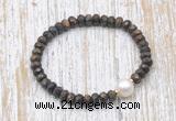 CFB754 faceted rondelle bronzite & potato white freshwater pearl stretchy bracelet