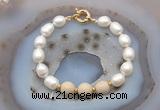 CFB946 Hand-knotted 9mm - 10mm rice white freshwater pearl & white fossil jasper bracelet