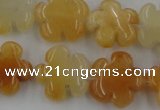 CFG1000 15.5 inches 16mm carved flower yellow jade beads