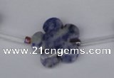 CFG1006 15.5 inches 20mm carved flower blue spot stone beads