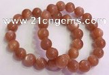 CGB4541 7.5 inches 12mm - 13mm round golden sunstone beaded bracelets