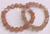 CGB4587 7.5 inches 8mm - 9mm round sunstone beaded bracelets