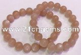 CGB4588 7.5 inches 10mm - 11mm round sunstone beaded bracelets