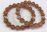 CGB4609 10mm - 11mm round golden rutilated quartz beaded bracelets