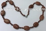 CGN201 22 inches 6mm round & 18*25mm oval goldstone necklaces