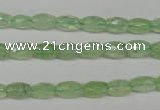 CRU165 15.5 inches 5*8mm faceted rice green rutilated quartz beads