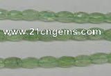 CRU165 15.5 inches 5*8mm faceted rice green rutilated quartz beads