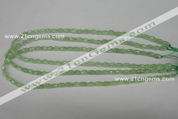 CRU165 15.5 inches 5*8mm faceted rice green rutilated quartz beads