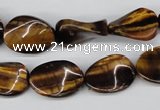 CTW63 15.5 inches 13*18mm twisted oval yellow tiger eye beads